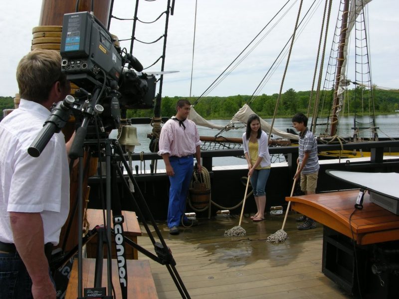 Film crew filming a scene on HMS Bee.