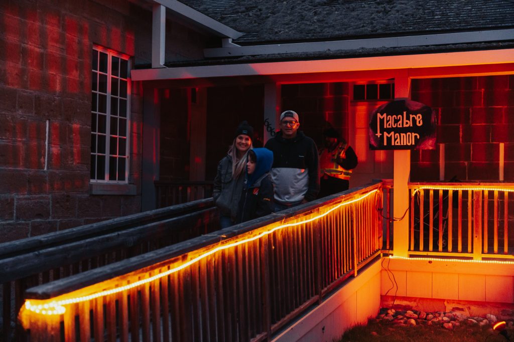 EDCNS_Fall2022_PumpkinfernoEvent_Web-72 A family exiting the macabre manor at Pumpkinferno