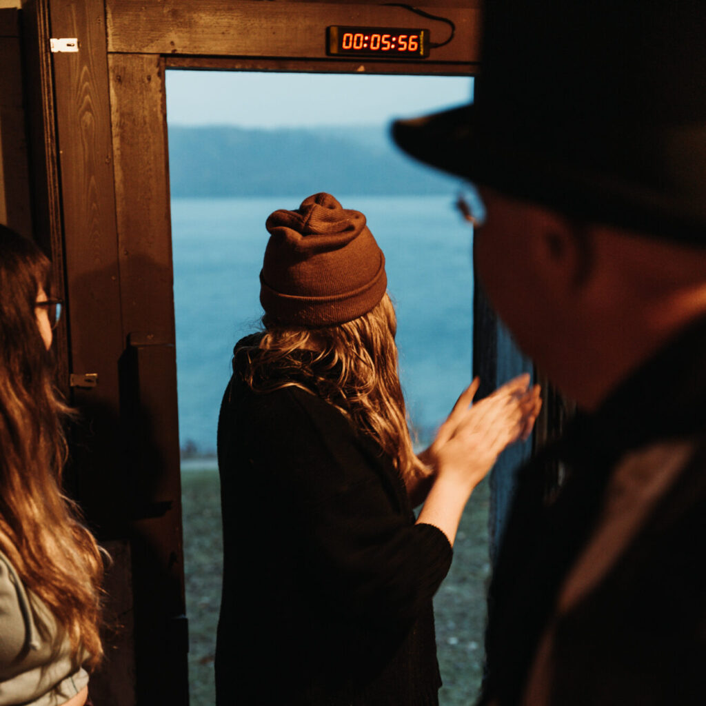 A guest applauding finding the solution to the escape room